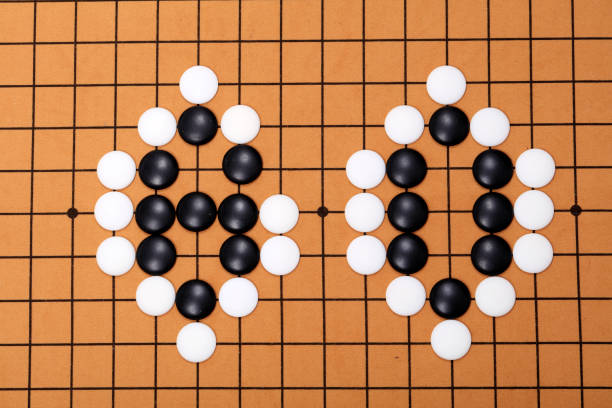 istock chinese game go,  Gobang and go game board 1329777997