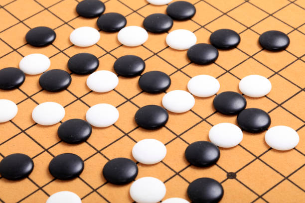 istock chinese game go,  Gobang and go game board 1329777999
