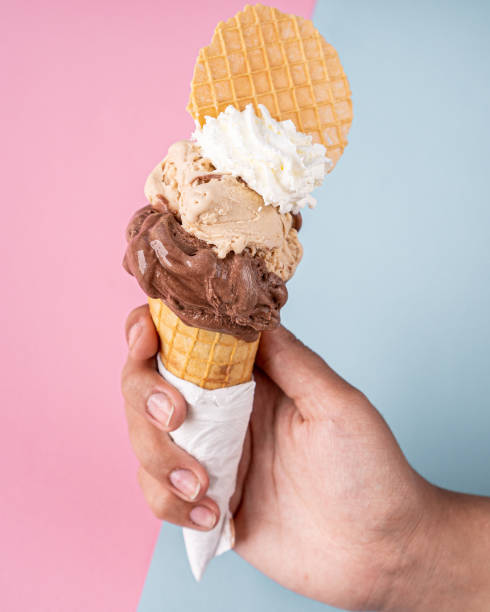 istock Exquisite chocolate, hazelnut and whipped cream cone. 1329778841