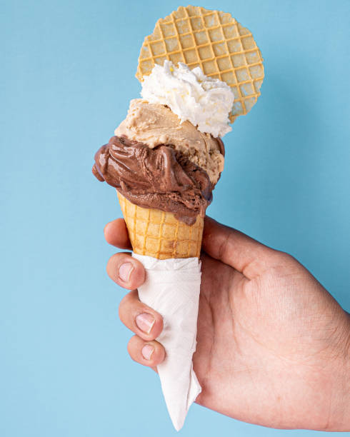 istock Exquisite chocolate, hazelnut and whipped cream cone. 1329779591
