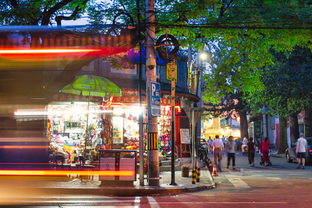 nightlife in beijing outdoor Beijing, China - July 18 2010 : nightlife in beijing in the summer is outside with small shops open city street street corner tree stock pictures, royalty-free photos & images