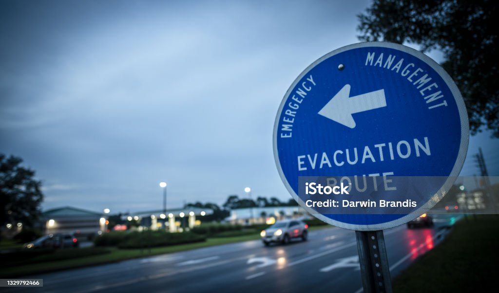 Hurricane Evacuation Route A sign leads hurricane evacuees to safety. Hurricane - Storm Stock Photo