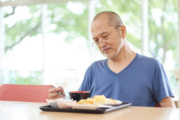 elderly people with anorexia in a long-term care facility - anorexia imagens e fotografias de stock