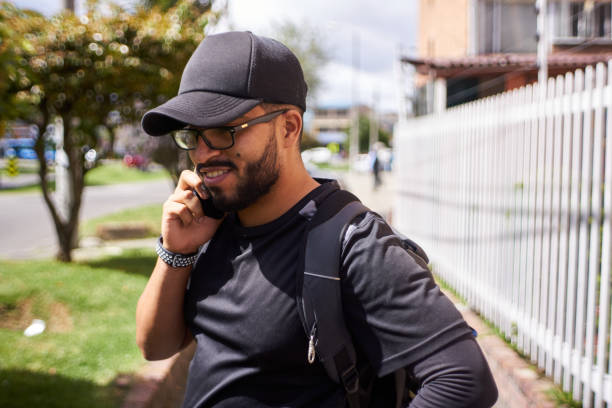 istock happy young man talking on the cell phone 1329800401