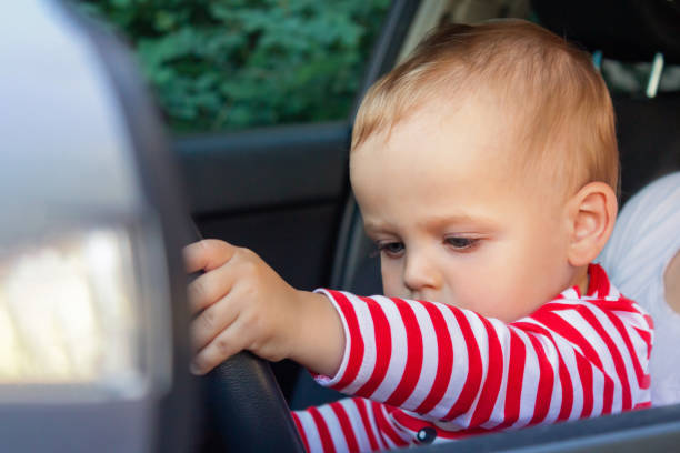 istock Baby boy driver. Travel with kids concept. 1329802264