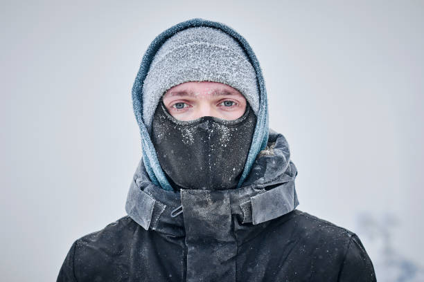 MAn's face covered with frost in winter stock photo