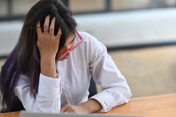 istock Young Asian woman feeling tired and bored with depression problems. 1329806170