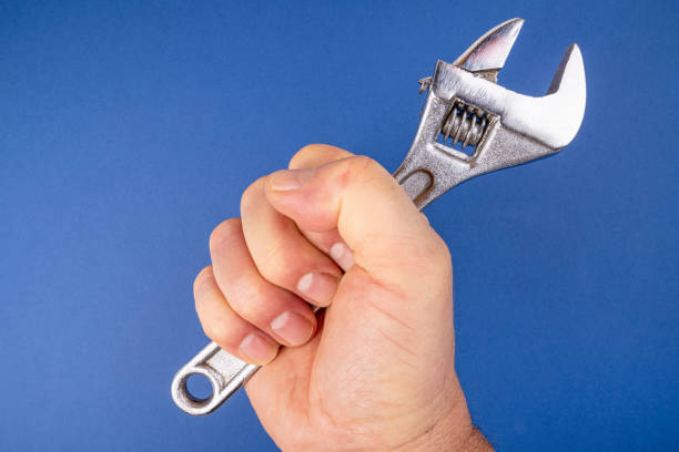 istock A wrench in the hand 1329806189