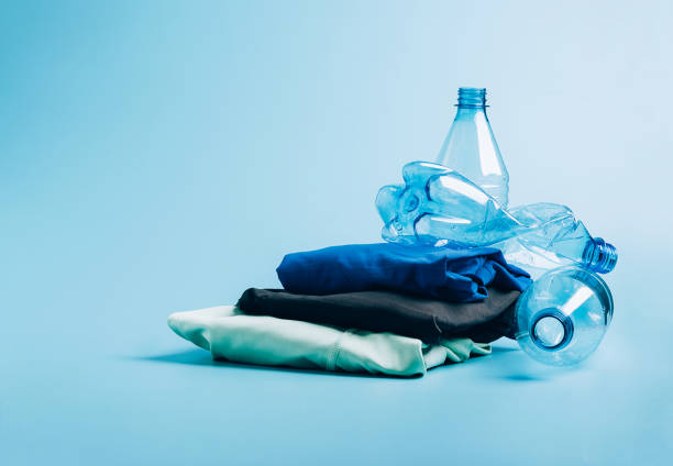 istock Polyester fiber synthetic fabrics eco-friendly textile recycled recyclable plastic bottles. Reuse recycling used bottles 1329810679