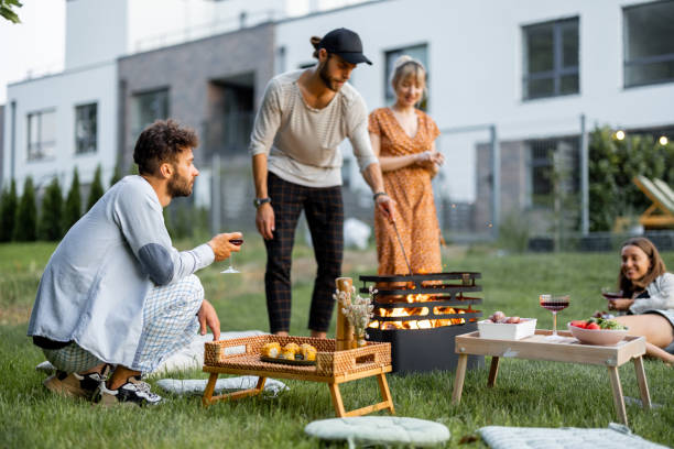 istock Friends have a picnic with barbeque at backyard 1329812384