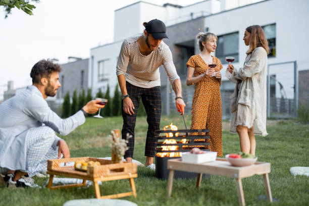istock Friends have a picnic with barbeque at backyard 1329812449