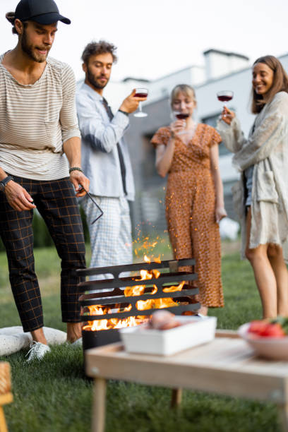 istock Friends have a picnic with barbeque at backyard 1329812478