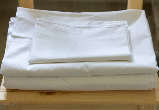 istock A set of white bed linen is lying on a chair. 1329813732