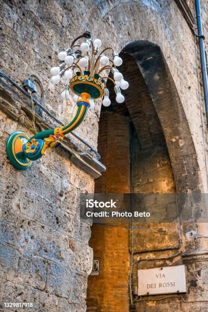The Detail Of A Lamppost With The Colors Of The Contrada Del Bruco In The Medieval Heart Of Siena Stock Photo - Download Image Now