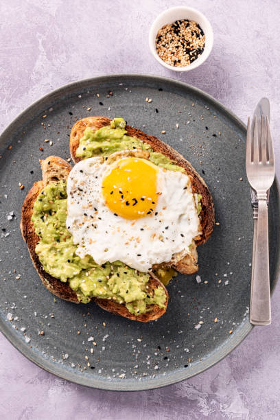 istock Avocado Toast with a Fried Egg and Toasted Sesame Seeds. 1329818062