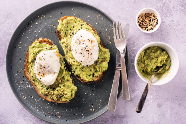 istock Avocado Toast with Eggs Benedict and Toasted Sesame Seeds. 1329818619