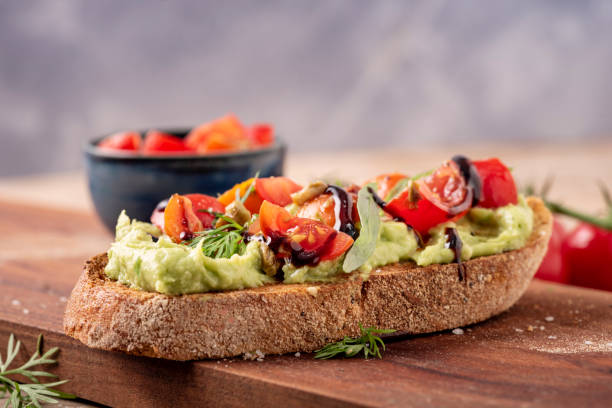 istock Avocado Toast with a Tomato Salsa Topping and Balsamic Vinegar 1329818661