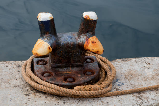 istock Old Dock Mooring Cleat and Rope at a Harbour Location 1329820037