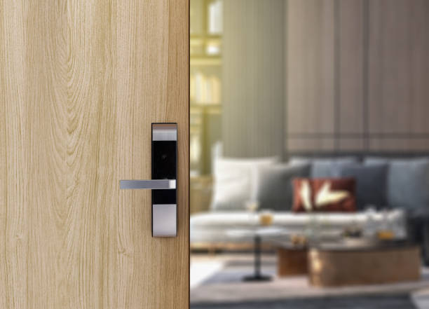 istock Digital Door handle or Electronics knob  for access to room security, Door wooden half opening through interior living room background 1329820203
