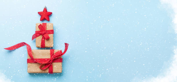 istock Christmas card with fir tree shaped gift boxes 1329821053