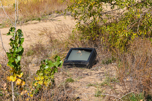 Old discarded TV set in a deserted place