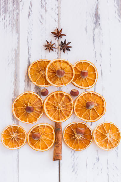 istock Christmas tree made of dried oranges, cinnamon and anise. Viewed from above. 1329821497