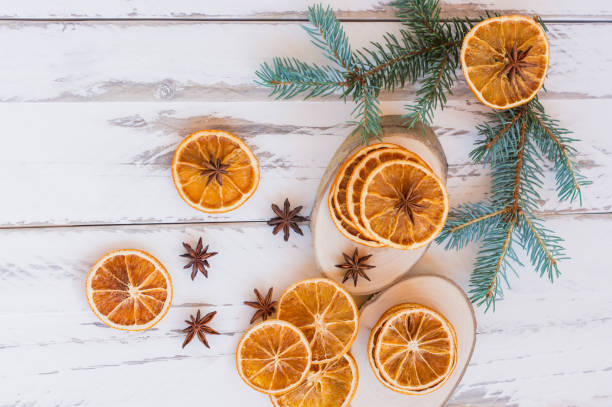 istock christmas background with fir branches, anise stars and oranges with copy space 1329821541
