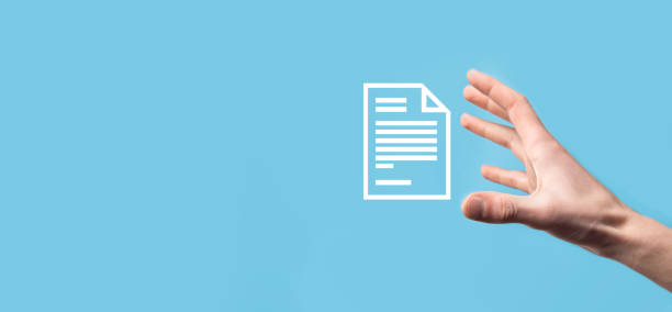 istock Male hand holding a document icon on blue background. Document Management Data System Business Internet Technology Concept. Corporate data management system DMS 1329825272
