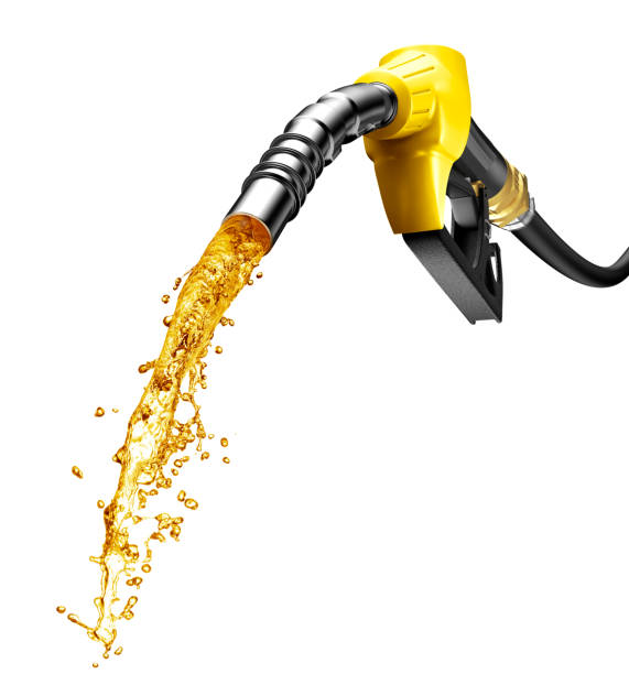 Gasoline gushing out from petrol pump nozzle stock photo