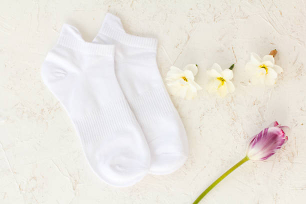 istock Pair of white socks on white background. 1329826383