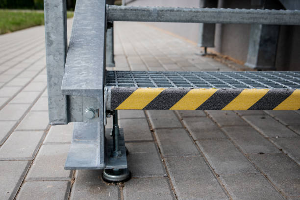 istock Yellow anti slip warning tape on stairs. Metal construction. Rescue exit 1329833408