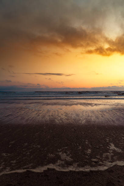 Warm sunset over the beach at Croyde, North Devon Warm sunset over the beach at Croyde, North Devon croyde bay photos stock pictures, royalty-free photos & images
