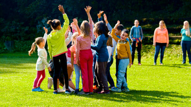istock Children waving hands with their coach before match 1329835616