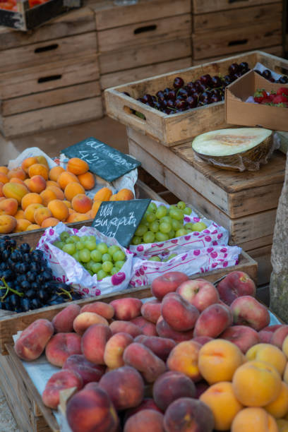 istock Fresh fruit on Display in Wooden Crates at a Rustic Fruit and Vegetable Market 1329835871