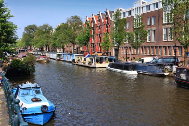 istock Amsterdam canal house boats 1329837123