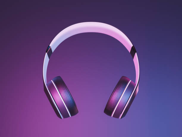 istock Wireless headphones on neon light background 1329837279