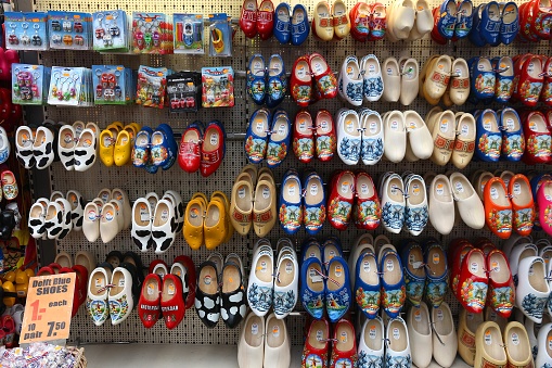 Dutch wooden shoes known as clogs at a gift store in Amsterdam. Decorative wooden clogs are a popular souvenir from the Netherlands.