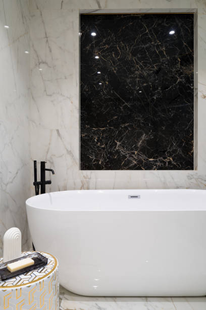 istock Fancy bathroom with marble tiles and freestanding bathtub 1329837417