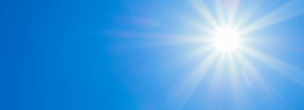 istock Bright sun with beautiful beams in the sky 1329837584