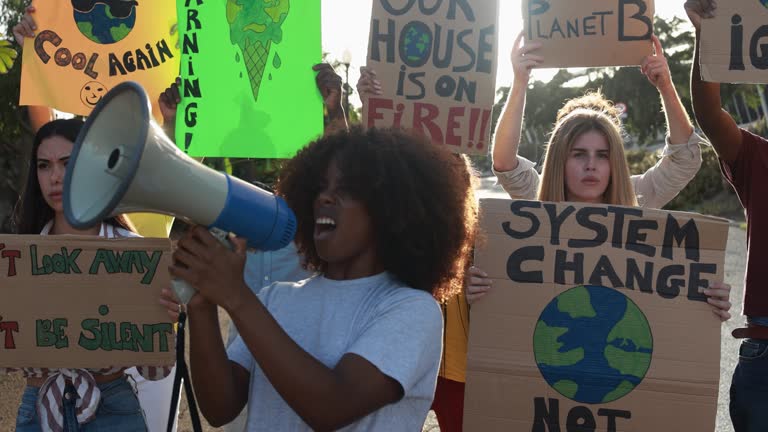 Group of demonstrators on road, young people from different culture and race fight for climate change