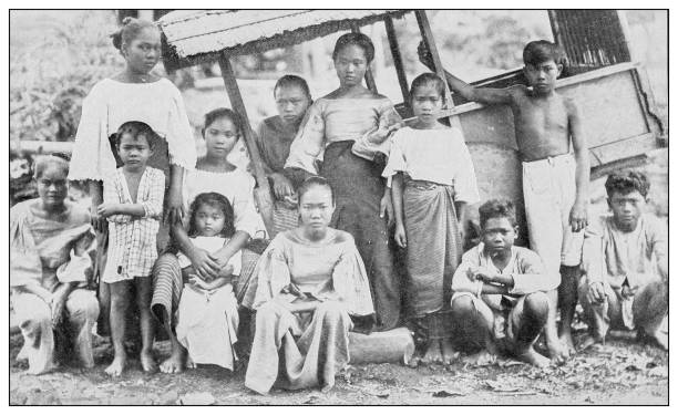 Antique black and white photograph: Tagalog family, Philippines Antique black and white photograph of people from islands in the Caribbean and in the Pacific Ocean; Cuba, Hawaii, Philippines and others: Tagalog family, Philippines filipino ethnicity photos stock illustrations