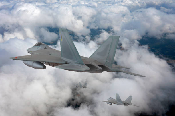 istock Jet fighters flying over the clouds. 1329841356