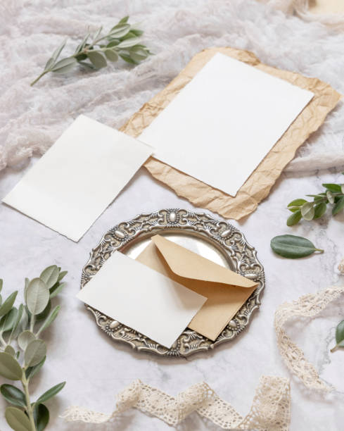 istock Wedding blank cards laying on a marble table decorated with eucalyptus branches 1329841574