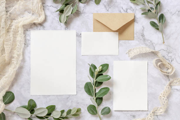 istock Wedding blank cards laying on a marble table decorated with eucalyptus branches 1329841619