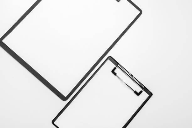 istock Black clipboard with blank white sheet attached on white background 1329842699