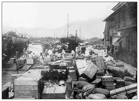 Antique black and white photograph of people from islands in the Caribbean and in the Pacific Ocean; Cuba, Hawaii, Philippines and others: Wharf and Bay, Manila, Philippines