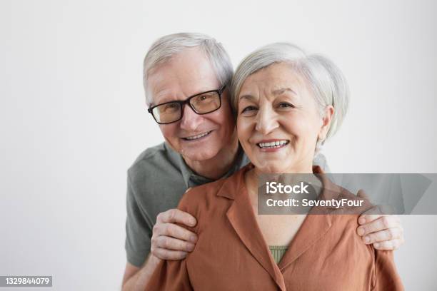 Portrait Of Smiling Senior Couple Stock Photo - Download Image Now - 80-89 Years, Senior Adult, Mature Couple