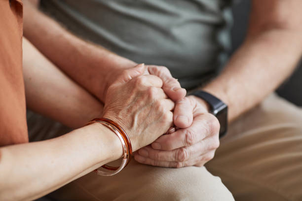 istock Senior Couple Holding Hands 1329844127