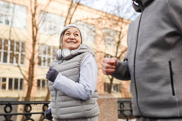 Smiling Senior Couple Running