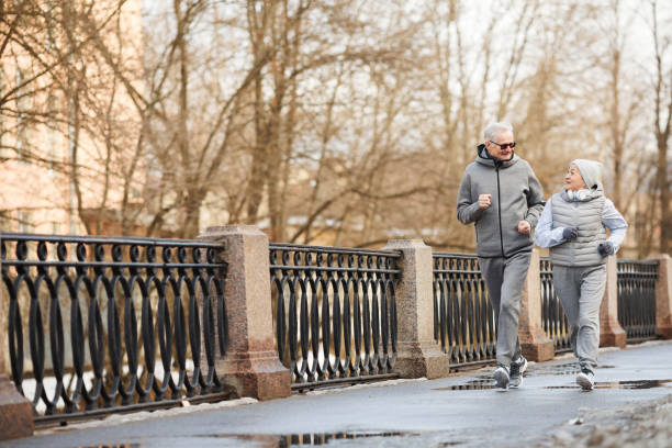 istock Senior Couple Running 1329844235